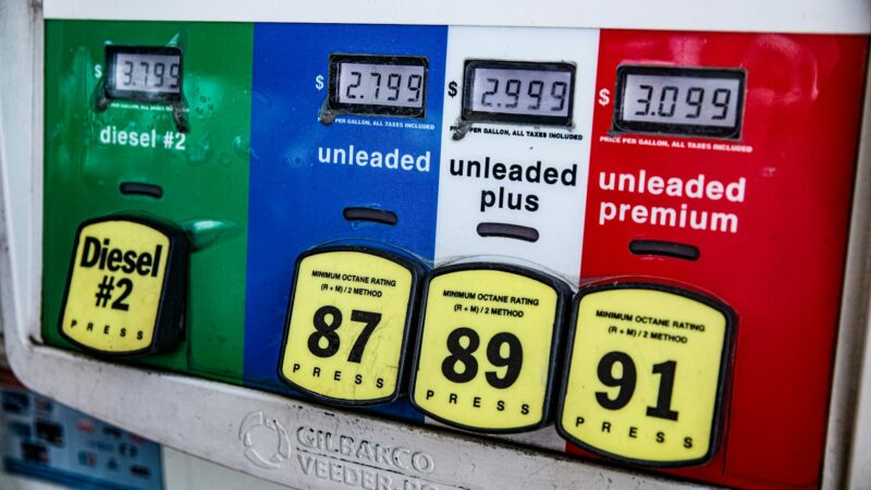 gas station price sign high fuel prices US consumer inflation - Photo by Ekaterina Belinskaya