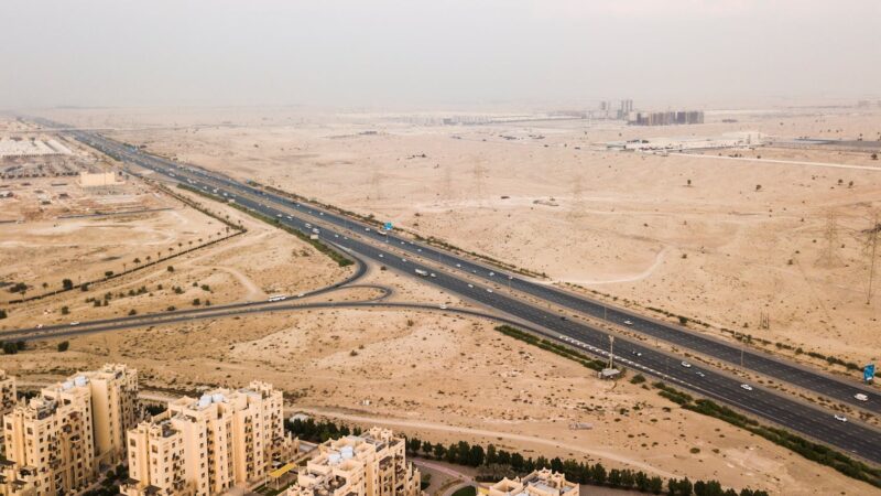 oil pipeline desert Saudi Arabia UAE infrastructure aerial view - Photo by The Lazy Artist Gallery