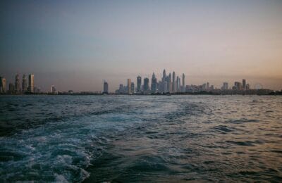 Skylines of Abu Dhabi and Dubai showcasing the investment opportunities in both UAE emirates