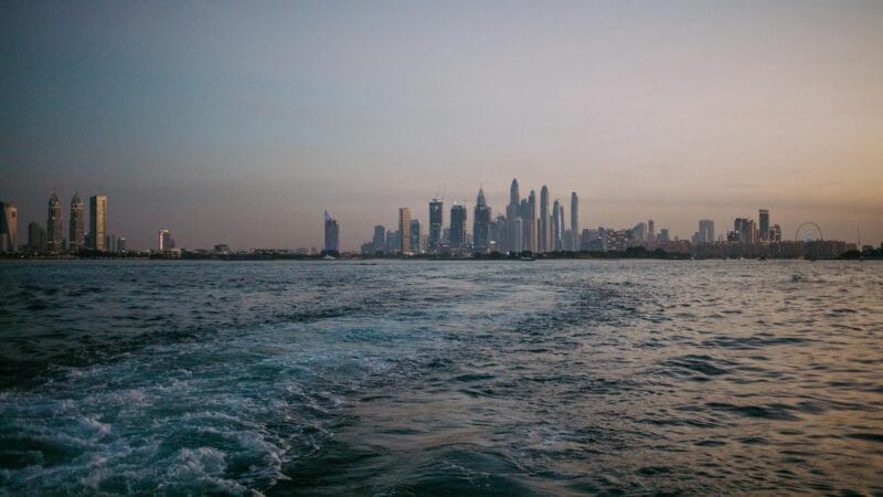 Skylines of Abu Dhabi and Dubai showcasing the investment opportunities in both UAE emirates