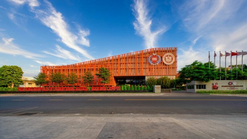 Modern international school campus in Dubai with students and contemporary architecture