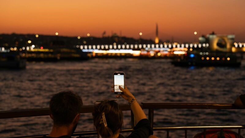 A cinematic scene from a Turkish drama series with Istanbul skyline at sunset in the background