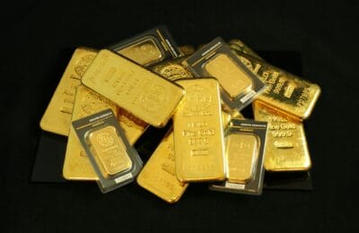 Gold bars stored in central bank vault representing institutional precious metal reserves