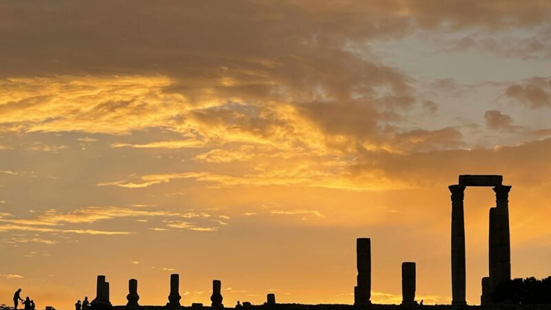 Budget-friendly Middle East travel destination with ancient ruins and dramatic sunset showcasing affordable tourism