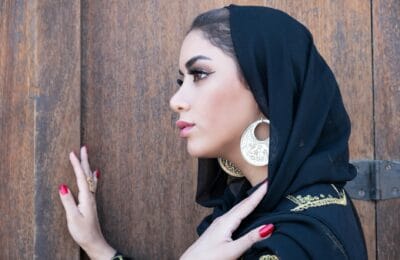 Elegant Arab woman embodying dark feminine energy with luxury beauty and cultural confidence