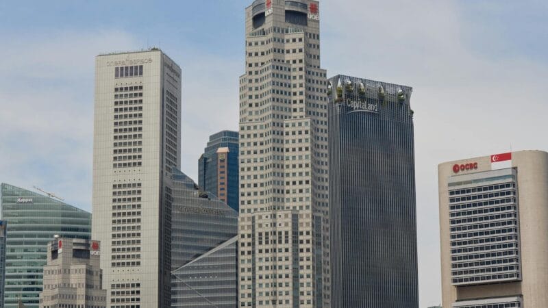 Split view comparing Dubai and Singapore modern skylines representing two global business hubs