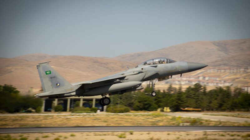 Fighter jet over Middle Eastern terrain representing the week 5 turning point in the 2026 Iran war