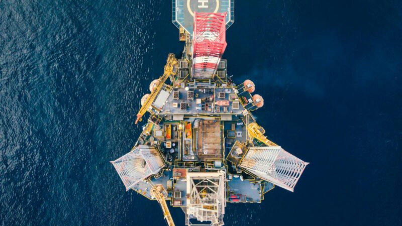 Offshore oil drilling platform representing global oil markets and Brent crude prices
