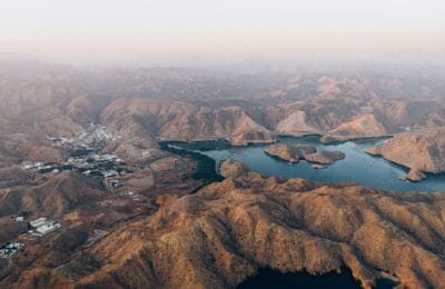 Beautiful coastal landscape of Muscat Oman showing mountains meeting the sea representing the growing appeal of Oman for expats in 2026