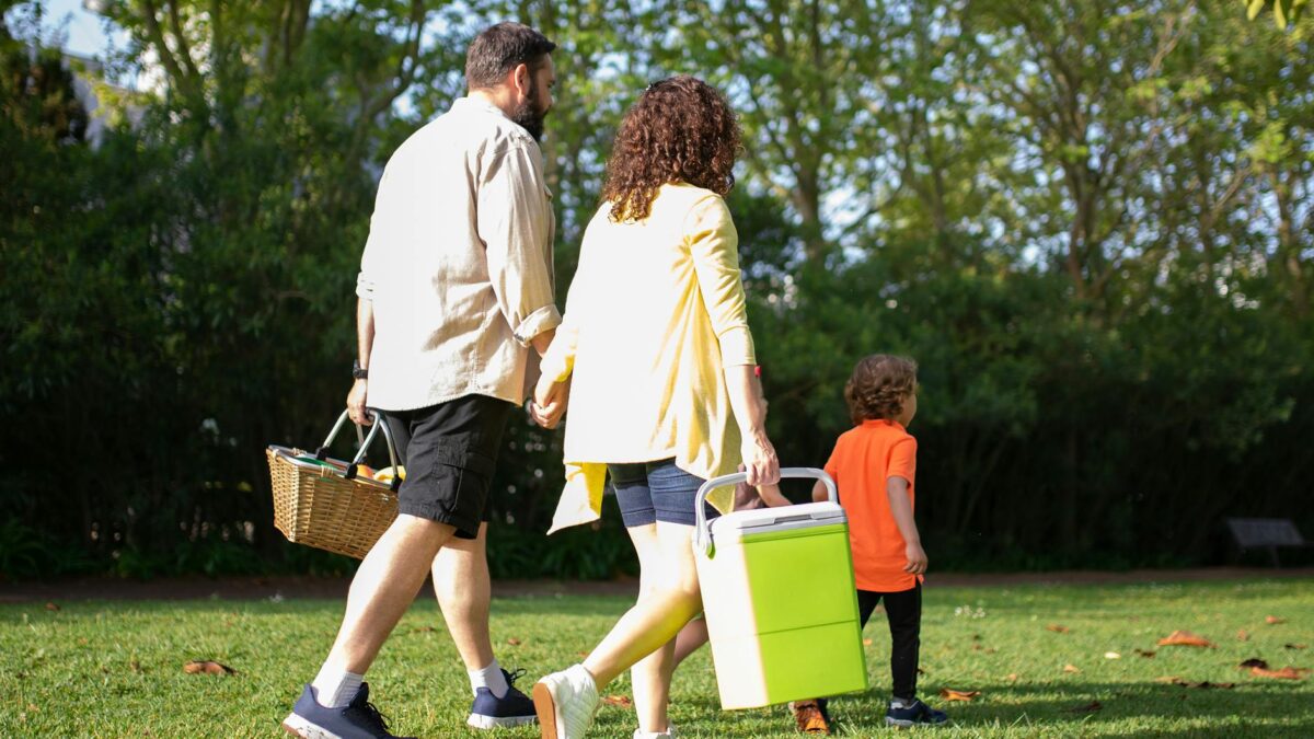 Egyptian family enjoying an outdoor spring picnic in a park celebrating Sham el-Nessim traditions