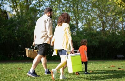 Egyptian family enjoying an outdoor spring picnic in a park celebrating Sham el-Nessim traditions