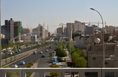 Construction cranes and skyscrapers on the Riyadh skyline representing Saudi Arabia's economic development