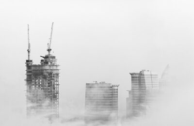 Dubai skyline with modern skyscrapers and construction cranes showing ongoing development and investment activity in 2026