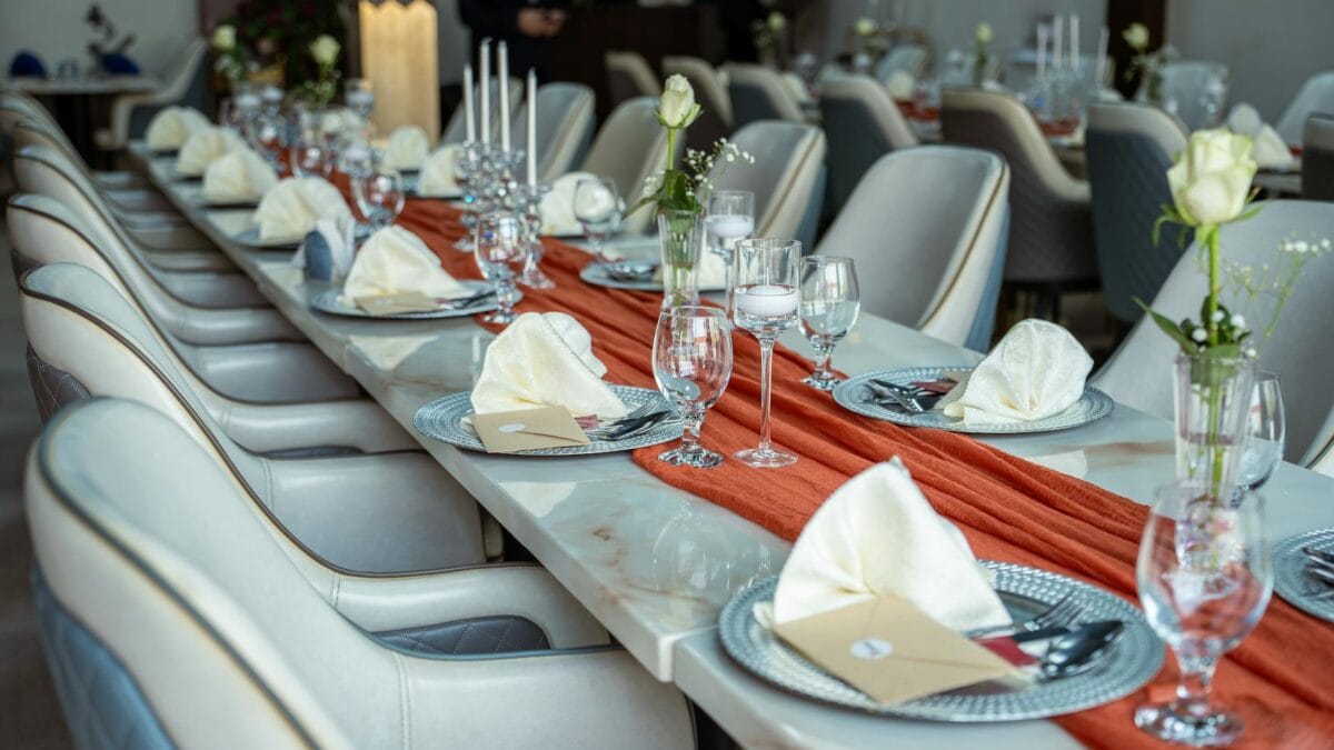 Elegant interior of a luxury Arab fine dining restaurant in Dubai with traditional design accents and modern table setting