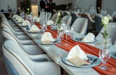 Elegant interior of a luxury Arab fine dining restaurant in Dubai with traditional design accents and modern table setting