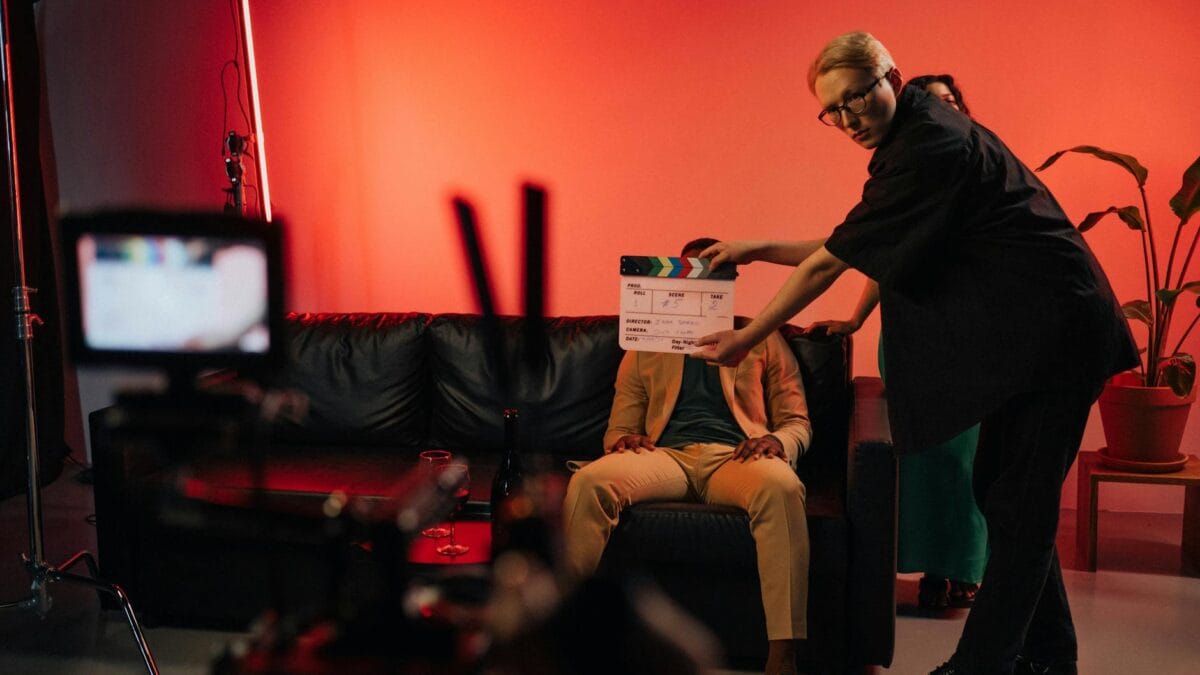 Behind the scenes of a television series production showing actors and cameras on set