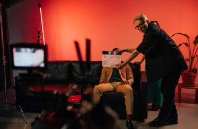 Behind the scenes of a television series production showing actors and cameras on set