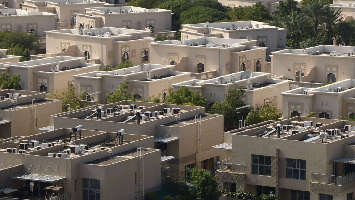 Arab family in a Dubai apartment reviewing grocery receipts and monthly bills